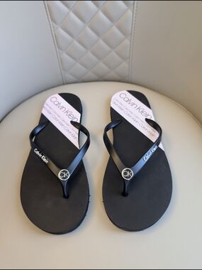 Calvin Klein Black Flip Flop Sandals with Pink Insole Accent